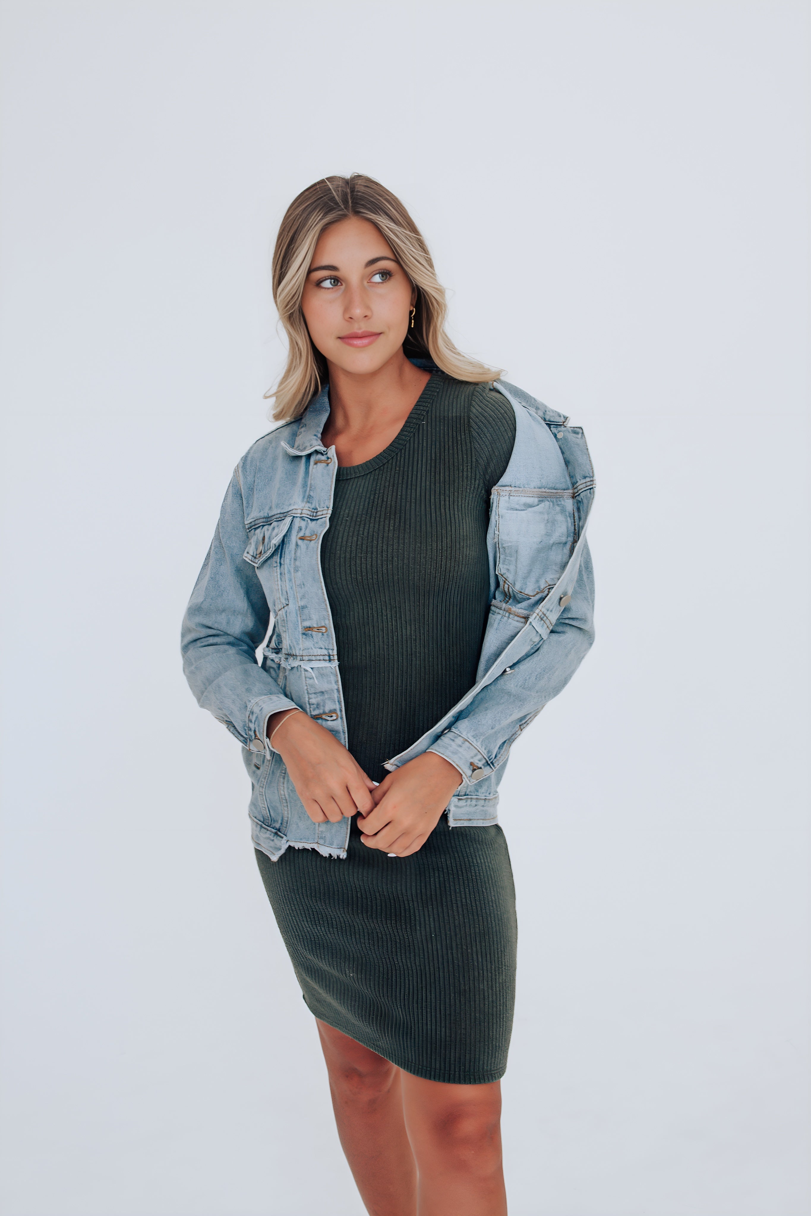 black bodycon dress with denim jacket