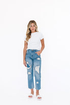 Distressed straight leg denim jean