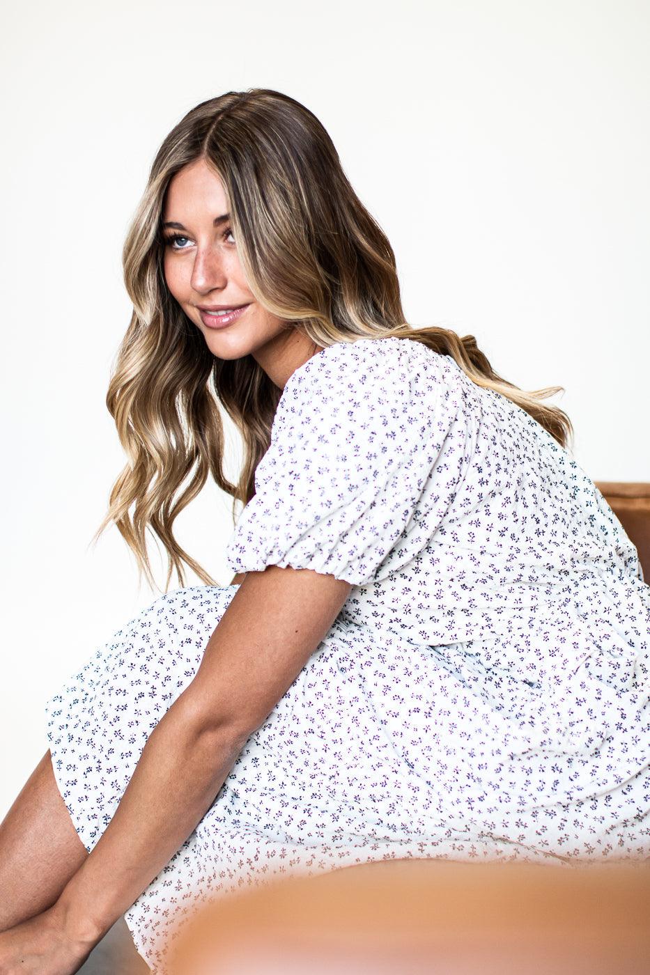 White dress with purple floral print